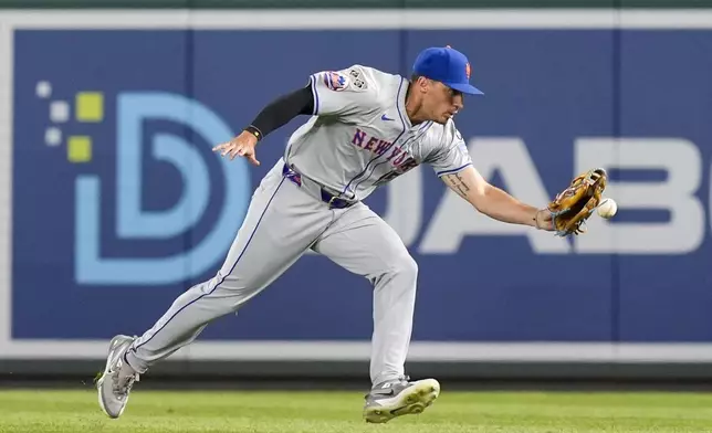 New York Mets right fielder Tyrone Taylor makes an error on a ball hit by Washington Nationals' Joey Meneses during the eighth inning of a baseball game at Nationals Park, Monday, July 1, 2024, in Washington. (AP Photo/Alex Brandon)