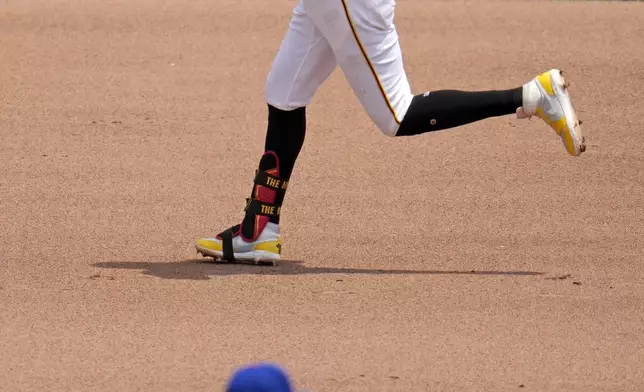 Pittsburgh Pirates' Oneil Cruz (15) rounds the bases after hitting a two-run home run off New York Mets starting pitcher Christian Scott , bottom, during the fourth inning of a baseball game in Pittsburgh, Monday, July 8, 2024. (AP Photo/Gene J. Puskar)