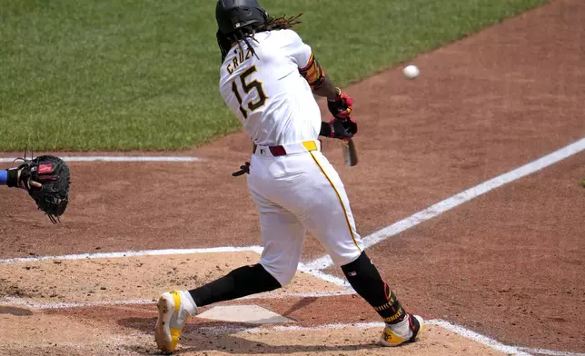 Pittsburgh Pirates' Oneil Cruz hits a two-run home run off New York Mets starting pitcher Christian Scott during the fourth inning of a baseball game in Pittsburgh, Monday, July 8, 2024. (AP Photo/Gene J. Puskar)