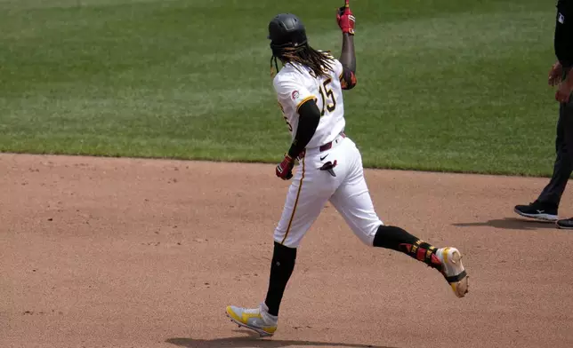 Pittsburgh Pirates' Oneil Cruz rounds the bases after hitting a two-run home run off New York Mets starting pitcher Christian Scott during the fourth inning of a baseball game in Pittsburgh, Monday, July 8, 2024. (AP Photo/Gene J. Puskar)