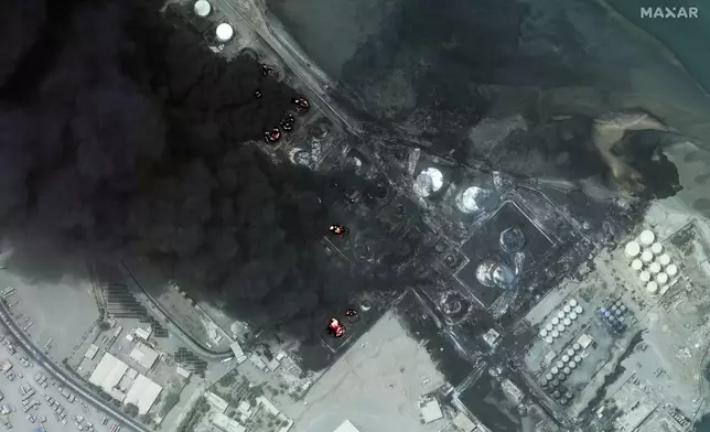 This satellite image provided by Maxar Technologies shows a close view of burning oil tanks in Hodeidah, Yemen, July 21, 2024. (Satellite image ©2024 Maxar Technologies via AP)