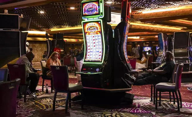 People play slot machines during the final night of operations and gaming at The Mirage on Tuesday, July 16, 2024, in Las Vegas. (Chase Stevens/Las Vegas Review-Journal via AP)