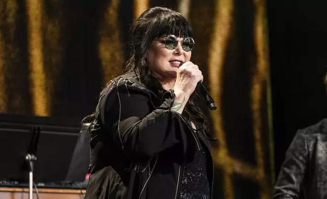 FILE - Ann Wilson performs during Farm Aid on Saturday, Sept. 23, 2023, in Noblesville, Ind. Wilson, lead singer of rock band Heart, says she has cancer. The band is postponing the remaining shows on its Royal Flush Tour. Wilson said in a statement Tuesday that she underwent a surgery to remove a cancerous growth and is recovering steadily, but that her doctors urged her to undergo preventive chemotherapy and take time off from performing (Photo by Amy Harris/Invision/AP, File)