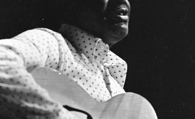 This image provided by the estate of Dick Waterman, shows Arthur Crudup performing in 1970. Crudup wrote the song “That’s All Right,” which Elvis Presley later recorded for his first single. (Dick Waterman via AP)