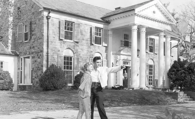 FILE - Elvis Presley with his girlfriend, Yvonne Lime, are photographed at his home, Graceland, in Memphis, Tenn., around 1957. (AP Photo, File)