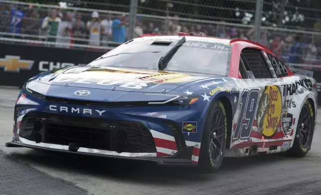 Martin Truex Jr. rounds Turn 6 during a NASCAR Cup Series auto race, Sunday, July 7, 2024, in Chicago. (AP Photo/Erin Hooley)