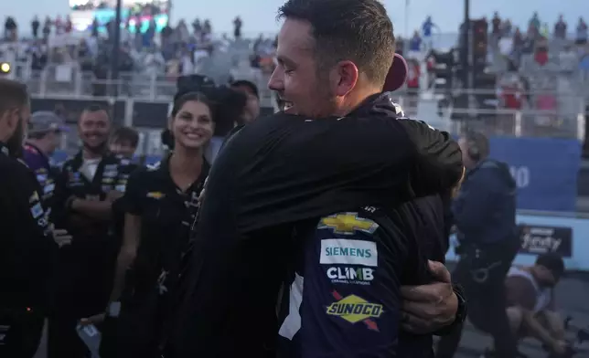 Alex Bowman hugs teammates after winning a NASCAR Cup Series auto race, Sunday, July 7, 2024, in Chicago. (AP Photo/Erin Hooley)