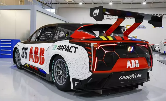 A prototype of the first electric racecar is displayed at the NASCAR R&amp;D Center in Concord, N.C., Monday, July 1, 2024. The top motorsports series in North America partnered with Chevrolet, Ford, Toyota and electrification company ABB to demonstrate a high-performance electric vehicle and gauge fan interest in electric racing. (AP Photo/Nell Redmond)