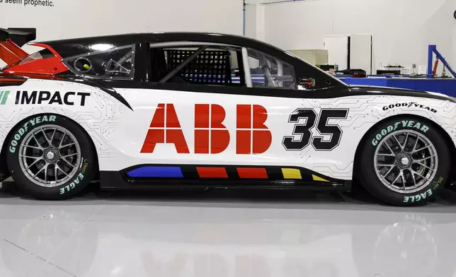 A prototype of the first electric racecar is displayed at the NASCAR R&amp;D Center in Concord, N.C., Monday, July 1, 2024. The top motorsports series in North America partnered with Chevrolet, Ford, Toyota and electrification company ABB to demonstrate a high-performance electric vehicle and gauge fan interest in electric racing. (AP Photo/Nell Redmond)