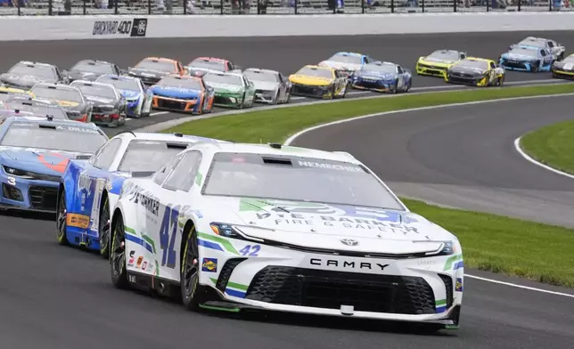 John Hunter Nemechek drives out of a turn during a NASCAR Cup Series auto race at Indianapolis Motor Speedway, Sunday, July 21, 2024, in Indianapolis. (AP Photo/Darron Cummings)