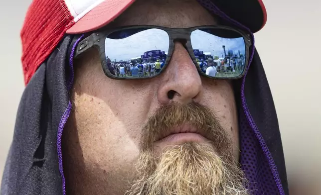 A fan listens to a concert before a NASCAR Cup Series auto race, Sunday, June 30, 2024, in Gladeville, Tenn. (AP Photo/Wade Payne)