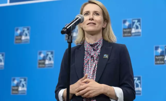 Estonia's Prime Minister Kaja Kallas speaks during her arrival at the NATO summit in Washington, Thursday, July 11, 2024. (AP Photo/Mark Schiefelbein)