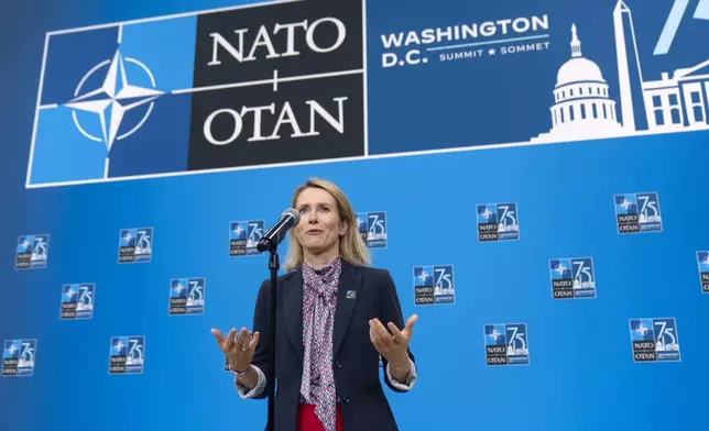 Estonia's Prime Minister Kaja Kallas speaks during her arrival at the NATO summit in Washington, Thursday, July 11, 2024. (AP Photo/Mark Schiefelbein)