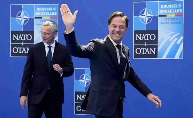 FILE - NATO Secretary General Jens Stoltenberg, left, greets Dutch Prime Minister Mark Rutte during arrivals for a NATO summit at NATO headquarters in Brussels, Monday, June 14, 2021. The United States is the most powerful member of NATO. It spends much more on defense than any other ally and far outweighs its partners in terms of military muscle. NATO's day-to-day work is led by its secretary-general Jens Stoltenberg, until he is replaced on Oct. 1, 2024 by Dutch Prime Minister Mark Rutte. (AP Photo/Francois Mori, Pool, File)