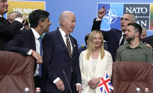 FILE - From left, Lithuania's President Gitanas Nauseda, British Prime Minister Rishi Sunak, President Joe Biden, Italy's Prime Minister Giorgia Meloni, NATO Secretary General Jens Stoltenberg and Ukraine's President Volodymyr Zelenskyy pose during a meeting of the NATO-Ukraine Council during a NATO summit in Vilnius, Lithuania, July 12, 2023. U.S. President Joe Biden and his NATO counterparts are meeting in Washington this week to mark the 75th anniversary of the world's biggest security organization just as Russia presses its advantage on the battlefield in Ukraine. (AP Photo/Pavel Golovkin, File)