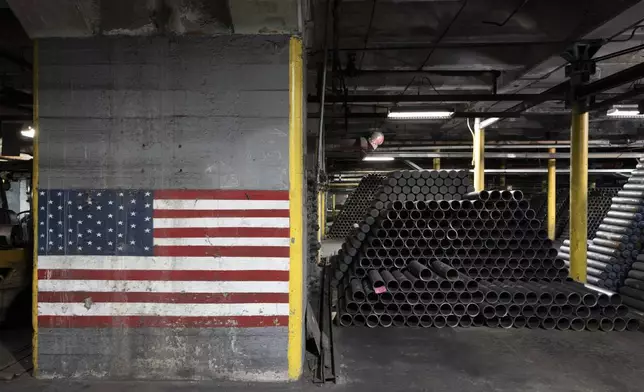 FILE - 155 mm M795 artillery projectiles are stacked during manufacturing process at the Scranton Army Ammunition Plant in Scranton, Pa., Thursday, April 13, 2023. The 155 mm howitzer round is one of the most requested artillery munitions of the Ukraine war. (AP Photo/Matt Rourke, File)