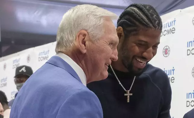 FILE - Los Angeles Clippers star Paul George, right, and Jerry West attend a groundbreaking ceremony of the Intuit Dome, Sept. 17, 2021, in Inglewood, Calif. The two-day NBA draft was tinged with sadness for the Clippers, who were without West in their war room. West spent the last seven years as a consultant for the team, helping recruit Kawhi Leonard and George. The Hall of Famer died June 12 at age 86. (AP Photo/Ringo H.W. Chiu, File)