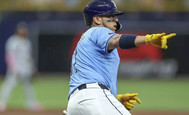 Tampa Bay Rays' Isaac Paredes celebrates after his home run against the Washington Nationals during the second inning of a baseball game Sunday, June 30, 2024, in St. Petersburg, Fla. (AP Photo/Mike Carlson)