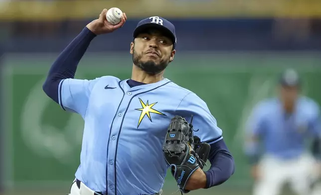 Tampa Bay Rays starting pitcher Taj Bradley throws against the Washington Nationals during the first inning of a baseball game, Sunday, June 30, 2024, in St. Petersburg, Fla. (AP Photo/Mike Carlson)