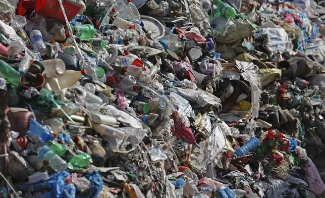 Garbage collected en route Mount Everest is piled before it is sorted for recycling at a facility operated by Agni Ventures, an agency that manages recyclable waste, in Kathmandu, Nepal, Monday, June 24, 2024. The highest camp on the world's tallest mountain is littered with garbage that is going to take years to clean up, according to a Sherpa who led a team that worked to clear trash and dig up dead bodies frozen for years near Mount Everest's peak. (AP Photo/Sanjog Manandhar)