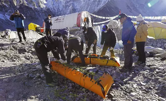 This image provided by the Peak Promotion shows recovered bodies of climbers being prepared to be airlifted from Everest base camp in Nepal, Wednesday, May 29, 2024. The Nepal government-funded team of soldiers and Sherpas removed 11 tons (24,000 pounds) of garbage, four dead bodies and a skeleton from Everest during this year's climbing season. (Peak Promotion via AP)