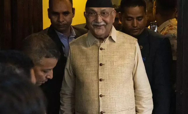 Khadga Prasad Oli, the chairman of the Communist Party of Nepal leaves his residence to meet his supporters after being appointed Prime Minister, in Kathmandu, Nepal, Sunday, July 14, 2024. The leader of the Nepal's largest communist party, Khadga Prasad Oli, was named the Himalayan nation's new prime minister on Sunday following the collapse of a previous coalition government. (AP Photo/Niranjan Shrestha)