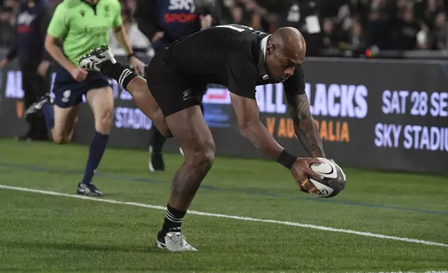 New Zealand Mark Tele'a scores a try against England during their rugby union test match in Auckland, New Zealand, Saturday, July 13, 2024. (Kerry Marshall/photosport via AP)