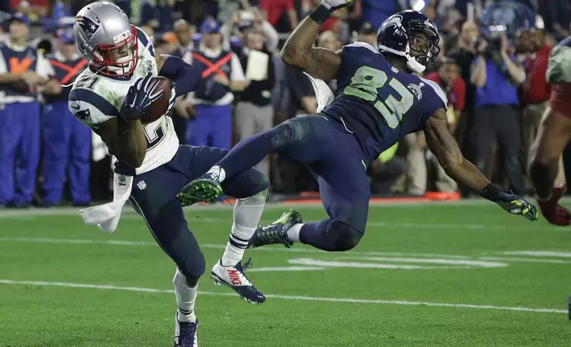 FILE - New England Patriots strong safety Malcolm Butler (21) intercepts a pass intended for Seattle Seahawks wide receiver Ricardo Lockette (83) during the second half of NFL Super Bowl XLIX football game Sunday, Feb. 1, 2015, in Glendale, Ariz. (AP Photo/Kathy Willens, File)