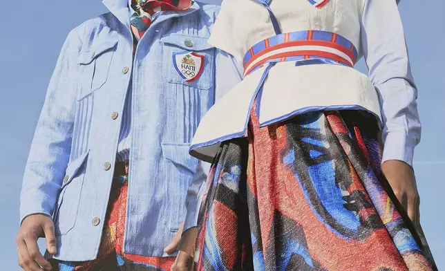 This image released by Stella Jean shows fashion to be worn by Haitian Olympic athletes at the 2024 Summer Olympics in Paris. Designer Stella Jean is collaborating with Haitian artist Philippe Dodard, whose vibrant painting will be incorporated into the ceremonial uniforms — a brightly hued skirt for women and pants for men. (Stella Jean via AP)