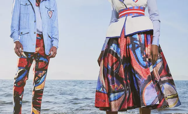 This image released by Stella Jean shows fashion to be worn by Haitian Olympic athletes at the 2024 Summer Olympics in Paris. Designer Stella Jean is collaborating with Haitian artist Philippe Dodard, whose vibrant painting will be incorporated into the ceremonial uniforms — a brightly hued skirt for women and pants for men. (Stella Jean via AP)