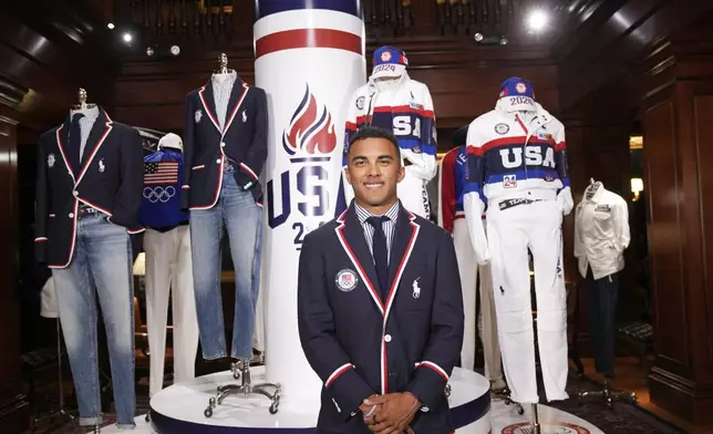 FILE - Olympic athlete in BMX racing, Kamren Larsen, models the Team USA Paris Olympics opening ceremony uniform at Ralph Lauren headquarters on Monday, June 17, 2024, in New York. (Photo by Charles Sykes/Invision/AP, File)