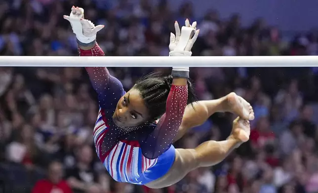 FILE - Simone Biles competes on the uneven bars at the United States Gymnastics Olympic Trials on Sunday, June 30, 2024, in Minneapolis. (AP Photo/Abbie Parr, File)