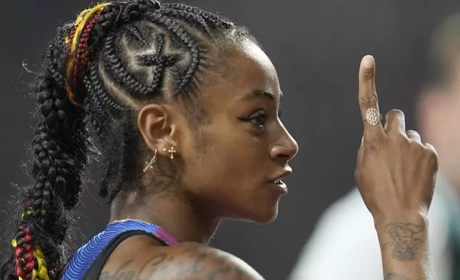 FILE - Sha'Carri Richardson, of the United States, reacts after the women's 100 meters during the World Athletics Championships in Budapest, Hungary, Monday, Aug. 21, 2023. (AP Photo/Ashley Landis, File)