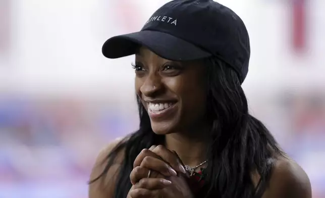 FILE - Olympic gold medalist Simone Biles Owens is interviewed after training at the Stars Gymnastics Sports Center in Katy, Texas, Monday, Feb. 5, 2024. (AP Photo/Michael Wyke, File)