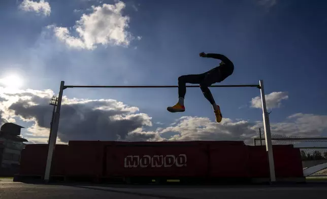 High jumper Oleh Doroshchuk trains at Zirka stadium, in Kropyvnytskyi, Ukraine, Friday, April 19, 2024. (AP Photo/Francisco Seco)