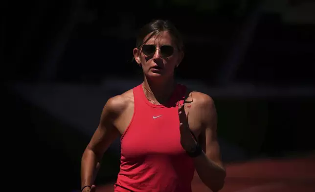 Ukrainian high jumper Kateryna Tabashnyk runs at the stadium that she shares with other Ukrainians training to qualify for the Paris Olympics in Monte Gordo, Portugal, Tuesday, May 7, 2024. (AP Photo/Emilio Morenatti)