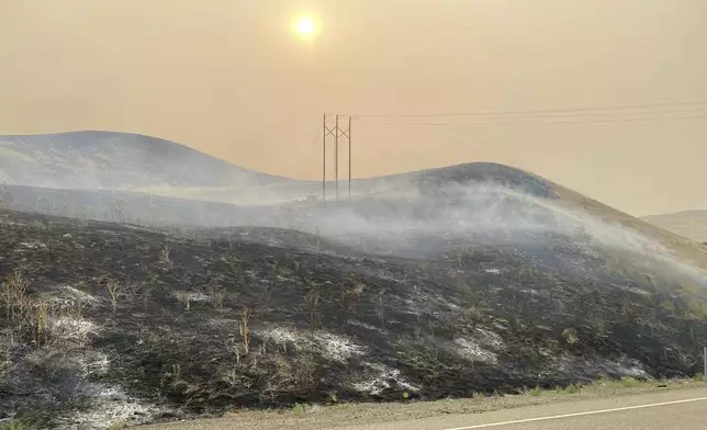 In this image provided by the Oregon Department of Transportation, shows an area burned by the Durkee fire near Interstate 84 close to Huntington, Ore., Tuesday afternoon, July 23, 2024. (Oregon Department of Transportation via AP)