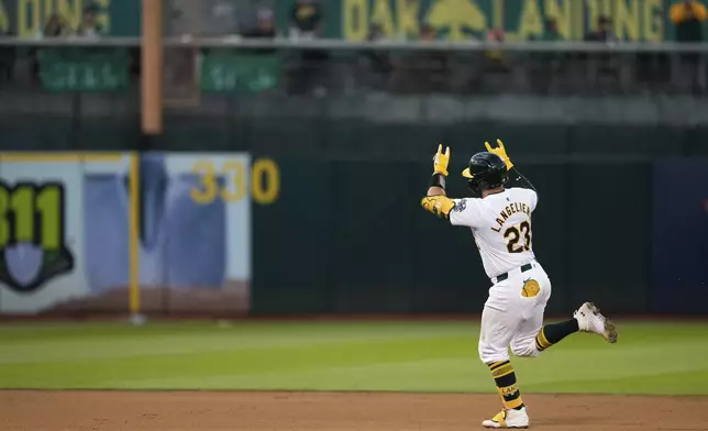 Oakland Athletics' Shea Langeliers runs the bases after hitting a solo home run against the Baltimore Orioles during the seventh inning of a baseball game Friday, July 5, 2024, in Oakland, Calif. (AP Photo/Godofredo A. Vásquez)