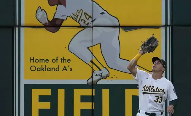 Oakland Athletics center fielder JJ Bleday catches a flyout hit by Baltimore Orioles' Jorge Mateo during the sixth inning of a baseball game Friday, July 5, 2024, in Oakland, Calif. (AP Photo/Godofredo A. Vásquez)