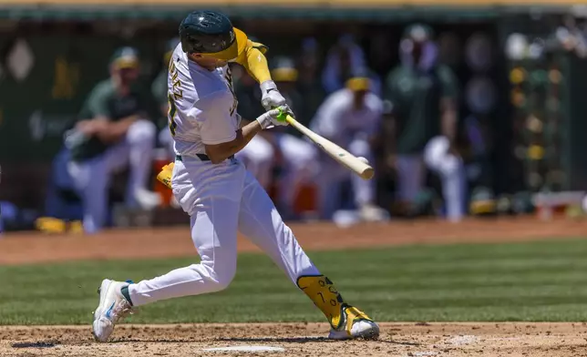 Oakland Athletics' Armando Alvarez hits a single against the Baltimore Orioles during the second inning of a baseball game Saturday, July 6, 2024, in Oakland, Calif. (AP Photo/John Hefti)