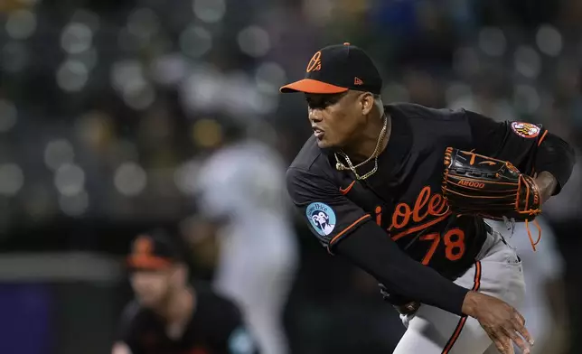 Baltimore Orioles pitcher Yennier Cano throws to an Oakland Athletics batter during the eighth inning of a baseball game Friday, July 5, 2024, in Oakland, Calif. (AP Photo/Godofredo A. Vásquez)