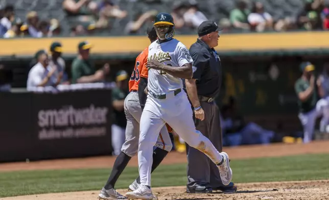 Oakland Athletics' Daz Cameron scores against the Baltimore Orioles during the second inning of a baseball game Saturday, July 6, 2024, in Oakland, Calif. (AP Photo/John Hefti)