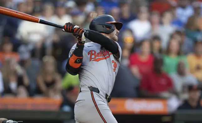Baltimore Orioles' Ryan O'Hearn hits a RBI-double during the third inning of a baseball game against the Seattle Mariners, Wednesday, July 3, 2024, in Seattle. (AP Photo/Stephen Brashear)