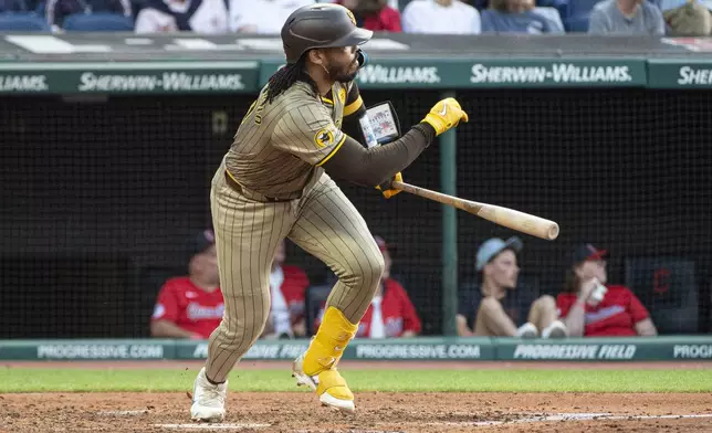 San Diego Padres' Luis Campusano watches his RBI single off Cleveland Guardians starting pitcher Gavin Williams during the fourth inning of a baseball game in Cleveland, Saturday, July 20, 2024. (AP Photo/Phil Long)