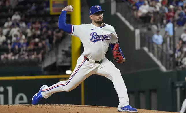 Texas Rangers starting pitcher Nathan Eovaldi throws during the first inning of a baseball game against the San Diego Padres in Arlington, Texas, Tuesday, July 2, 2024. (AP Photo/LM Otero)