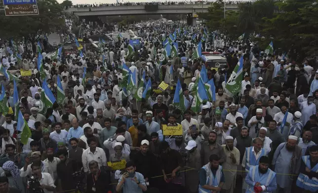 Supporters of the Pakistani religious group "Jamaat-e-Islami" chant anti-government slogans during a protest against the price hike and additional taxes and increasing electricity and gas tariffs, in Islamabad, Pakistan, Friday, July 26, 2024. (AP Photo/W.K. Yousafzai)