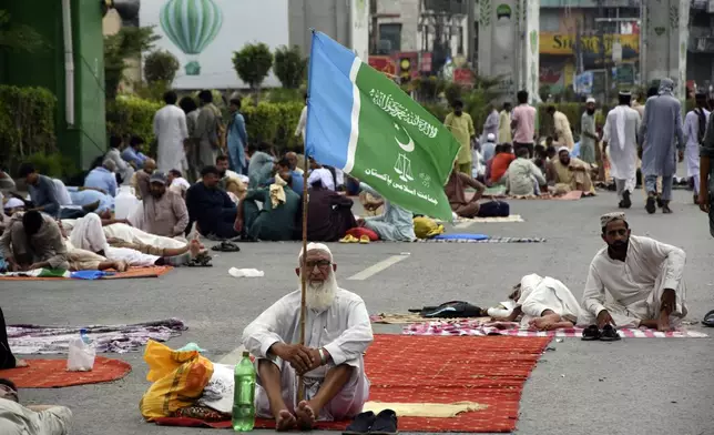 Supporters of the Pakistani religious group "Jamaat-e-Islami" stage a sit-in protest in the city of Rawalpindi, Pakistan, Saturday, July 27, 2024. Hundreds of supporters of a key Islamist party began a sit-in protest in the garrison city of Rawalpindi late Friday after authorities detained dozens to prevent them from holding the rally in Pakistan's neighboring capital, citing security reasons, officials said. (AP Photo/W.K. Yousafzai)