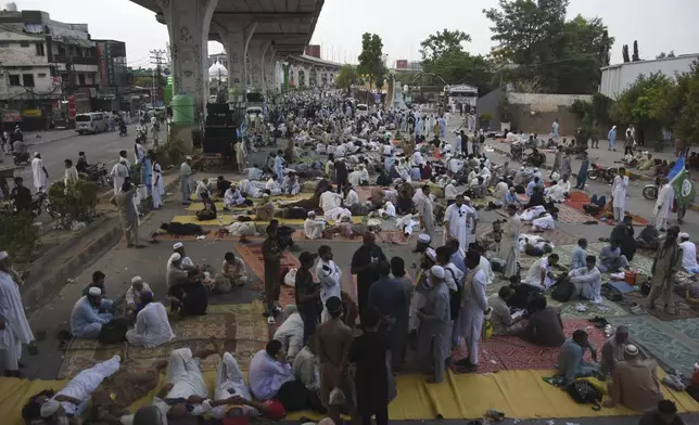 Supporters of the Pakistani religious group "Jamaat-e-Islami" sit during a protest in the city of Rawalpindi, Pakistan, Saturday, July 27, 2024. Hundreds of supporters of a key Islamist party began a sit-in protest in the garrison city of Rawalpindi late Friday after authorities detained dozens to prevent them from holding the rally in Pakistan's neighboring capital, citing security reasons, officials said. (AP Photo/W.K. Yousafzai)