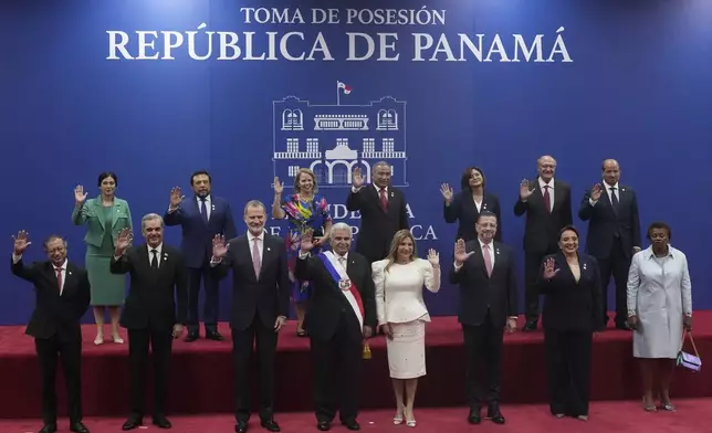 New Panamanian President Jose Raul Mulino, center, poses for a photo alongside his wife and world leaders at his swearing-in ceremony at the Atlapa Convention Centre in Panama City, Monday, July 1, 2024. (AP Photo/Matias Delacroix)