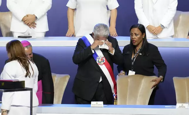 New Panamanian President Jose Raul Mulino cries at his swearing-in ceremony at the Atlapa Convention Centre in Panama City, Monday, July 1, 2024. (AP Photo/Matias Delacroix)